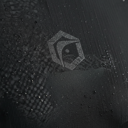 Close-up of premium moisture-wicking boxing compression fabric showing weave and stretch texture.