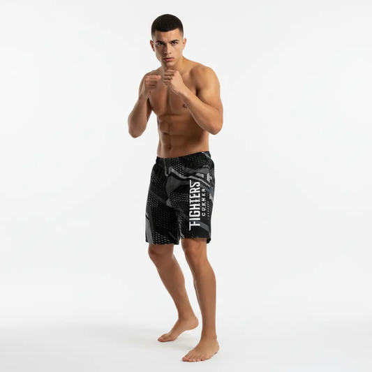 Fighters Corner black camouflage boxing shorts athletic pose mockup with man wearing fight wear for boxing gear, combat sports and athletic wear