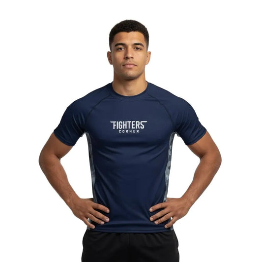 Man wearing a navy blue athletic shirt with 'Fighters Corner' logo on a gray background
