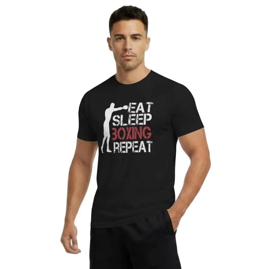 Full-body view of man wearing black 'Eat Sleep Boxing Repeat' T-shirt by Fighters Corner with black shorts.