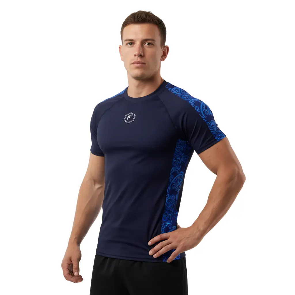 Man wearing a navy athletic shirt with blue accents on a white background