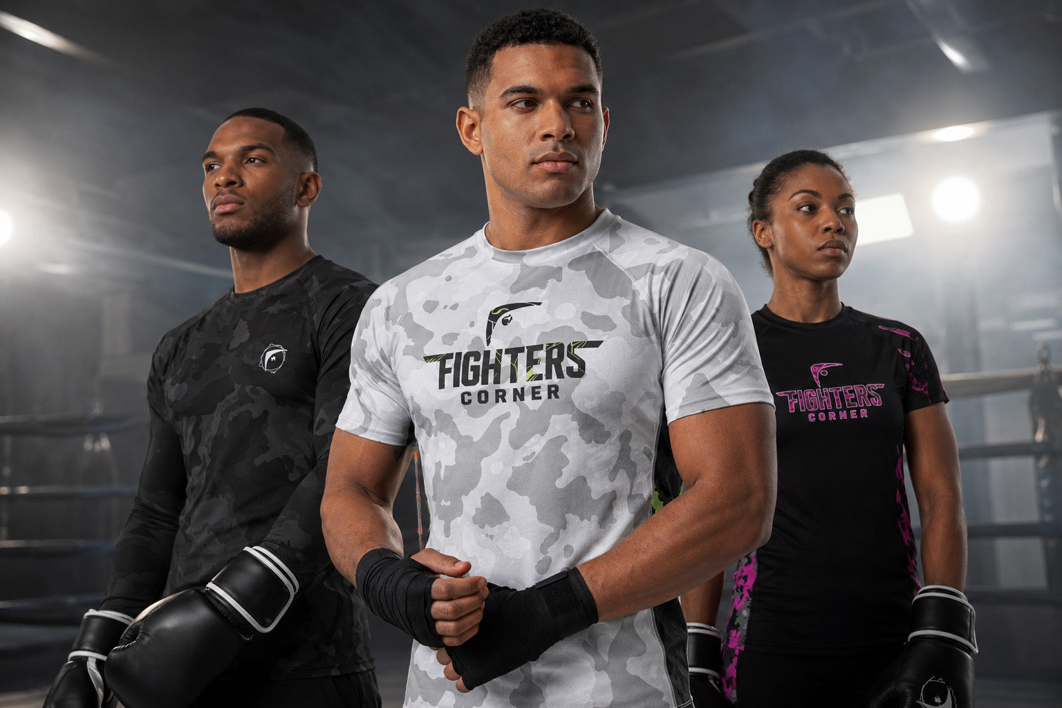 Male and female boxers wearing Fighters Corner compression shirts and boxing gear standing in a smoky boxing ring.