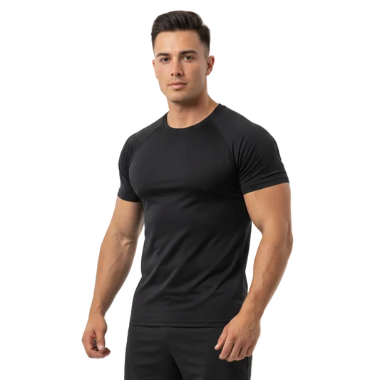 A muscular man modeling a black short-sleeve athletic t-shirt and matching black athletic shorts against a solid white background.