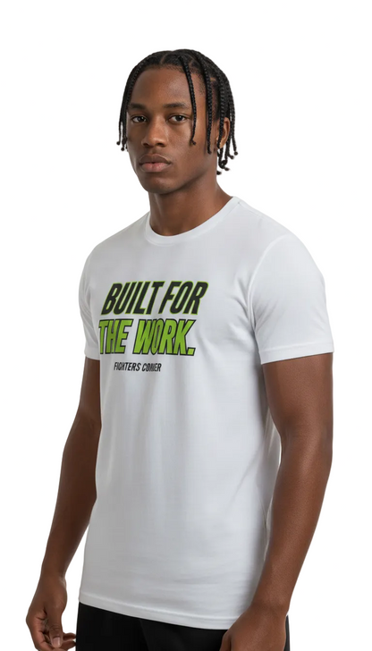 A man wearing a white short-sleeve t-shirt with a green and black graphic print that reads 'BUILT FOR THE WORK. FIGHTERS SOMBER' on the chest, set against a plain white background.
